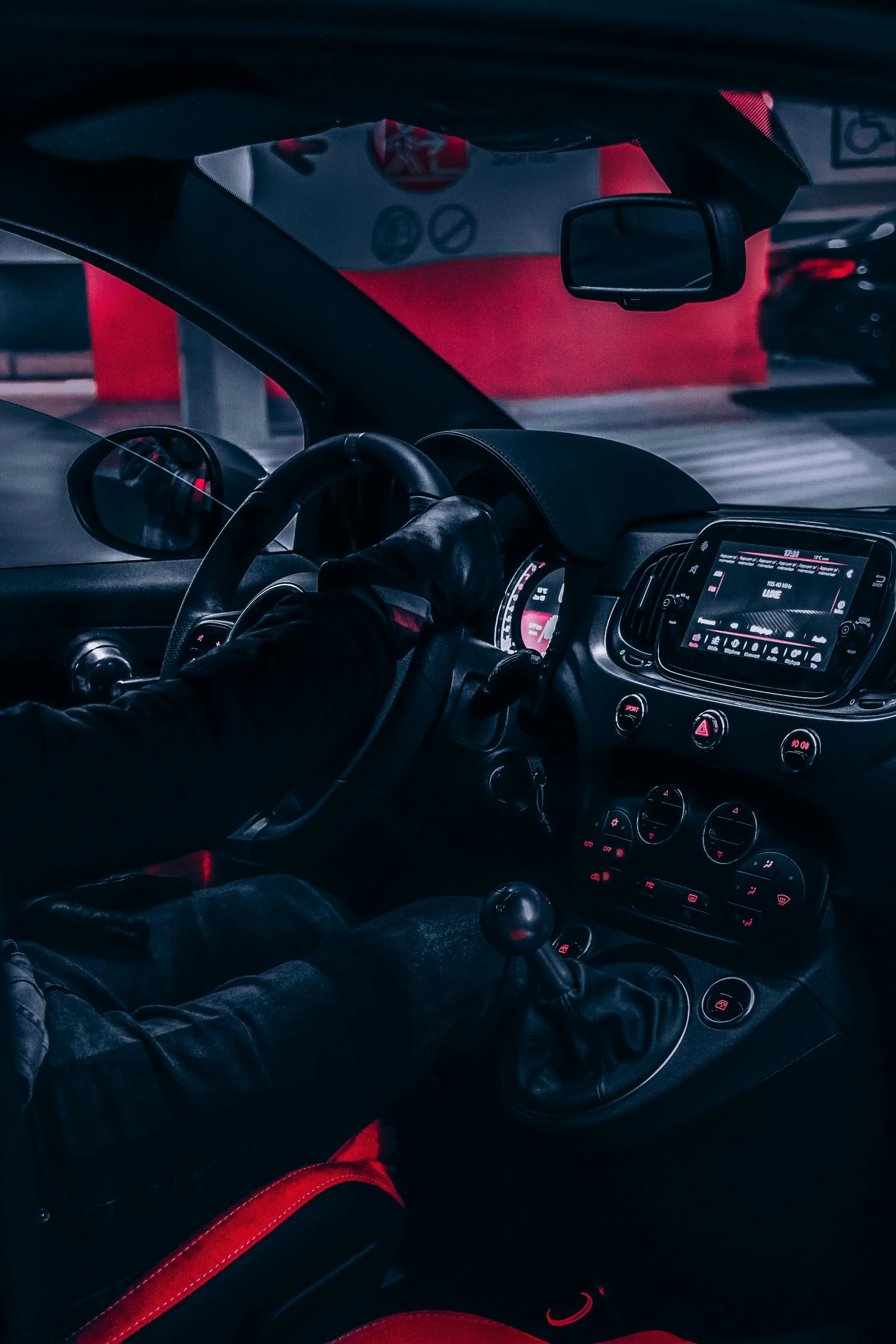 a car is shown with red trimming and black leather