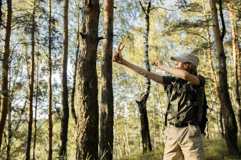 a  is playing with a small toy in the woods