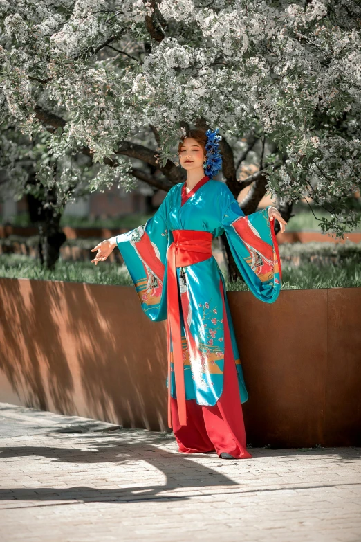 a woman in a blue and orange dress