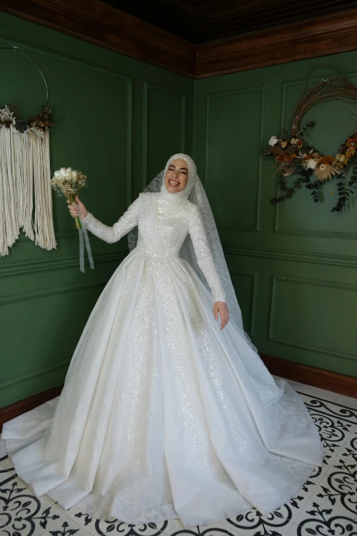 the woman is posing in her wedding dress
