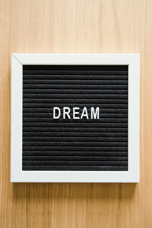 a black and white frame with the word dream above it