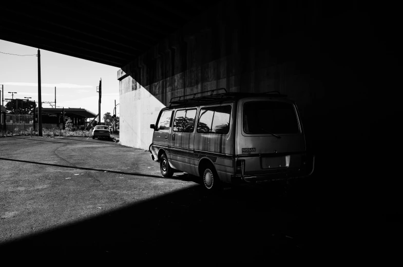 two cars are parked next to a garage