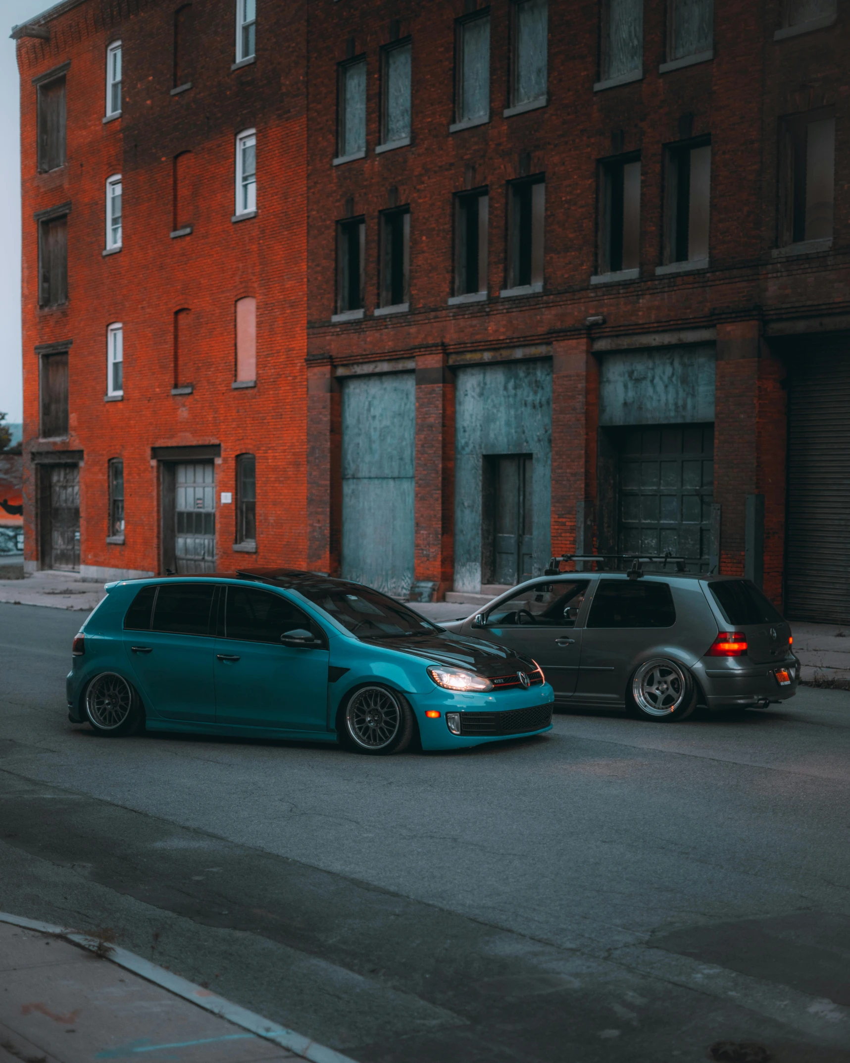 two cars are parked on the side of the street