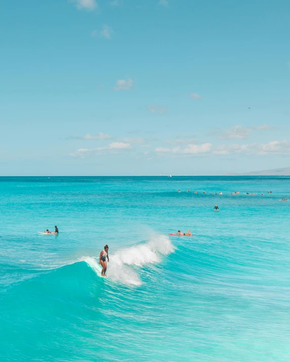 there is a male surfer riding a wave on the beach