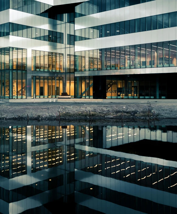 an abstract pograph of an office building with reflection on the water