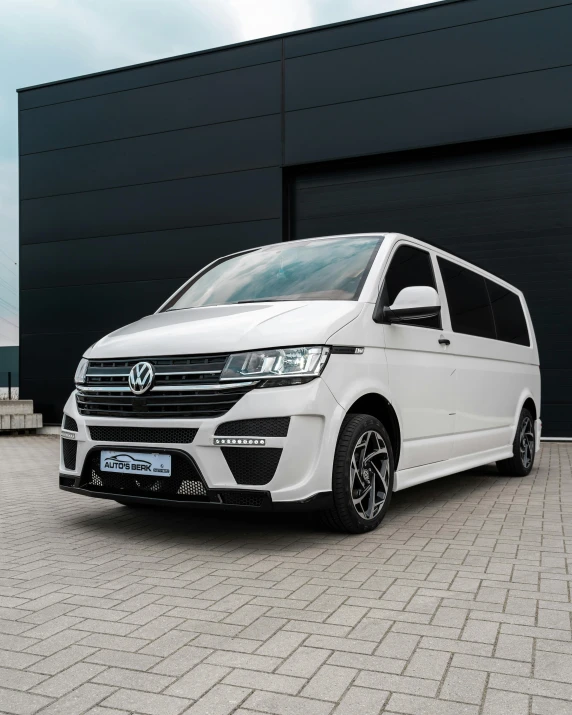 a white van parked outside a warehouse