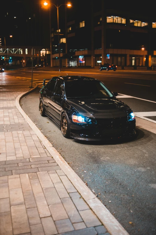 a black car parked on the side of the road