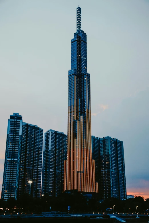 a tall building with lights shines at the top