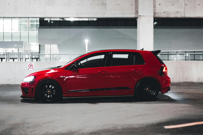 a red car parked in a parking lot