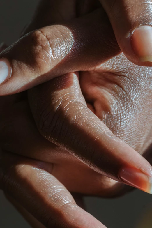 close up of someone's hands that have nails on them