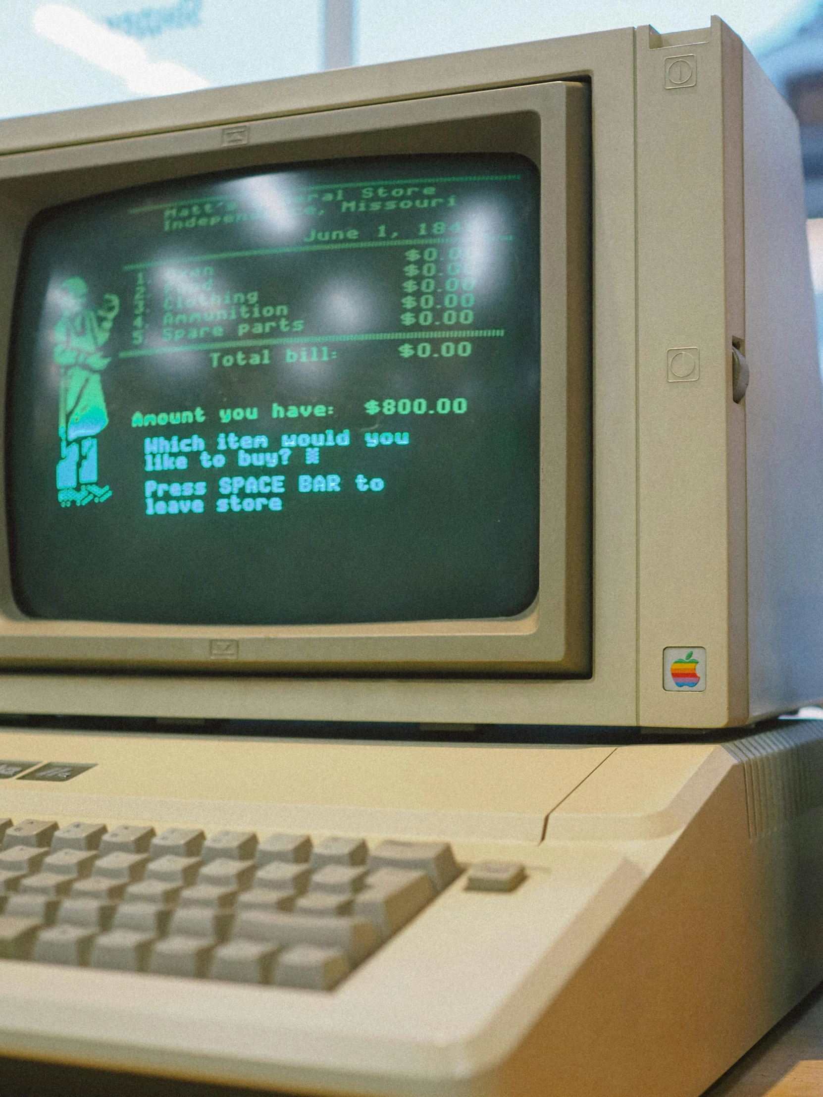 an old computer sitting on top of a desk