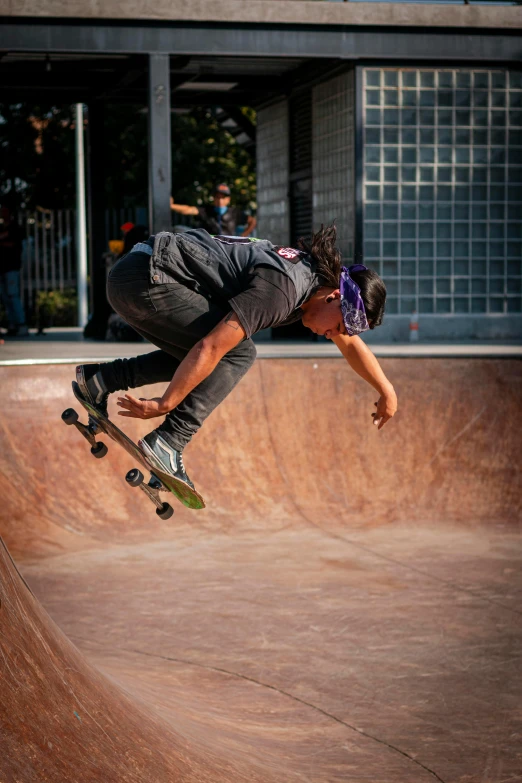 a man flying through the air on top of a skateboard