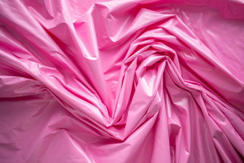 a pink fabric is shown in close up