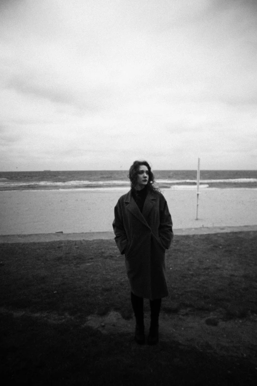 a person standing near the beach with soing in their hand