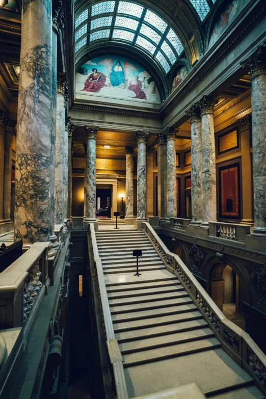 the ceiling of a building with stairs leading up to a second floor