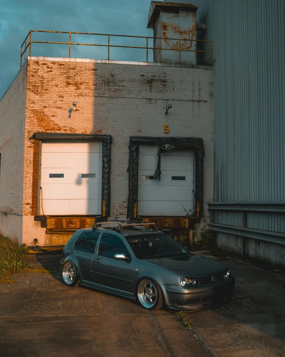 two cars parked in front of a building