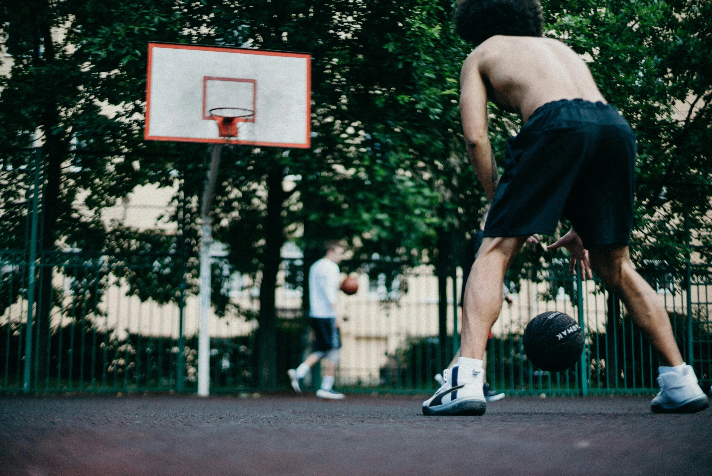 a man playing basketball on a basketball court