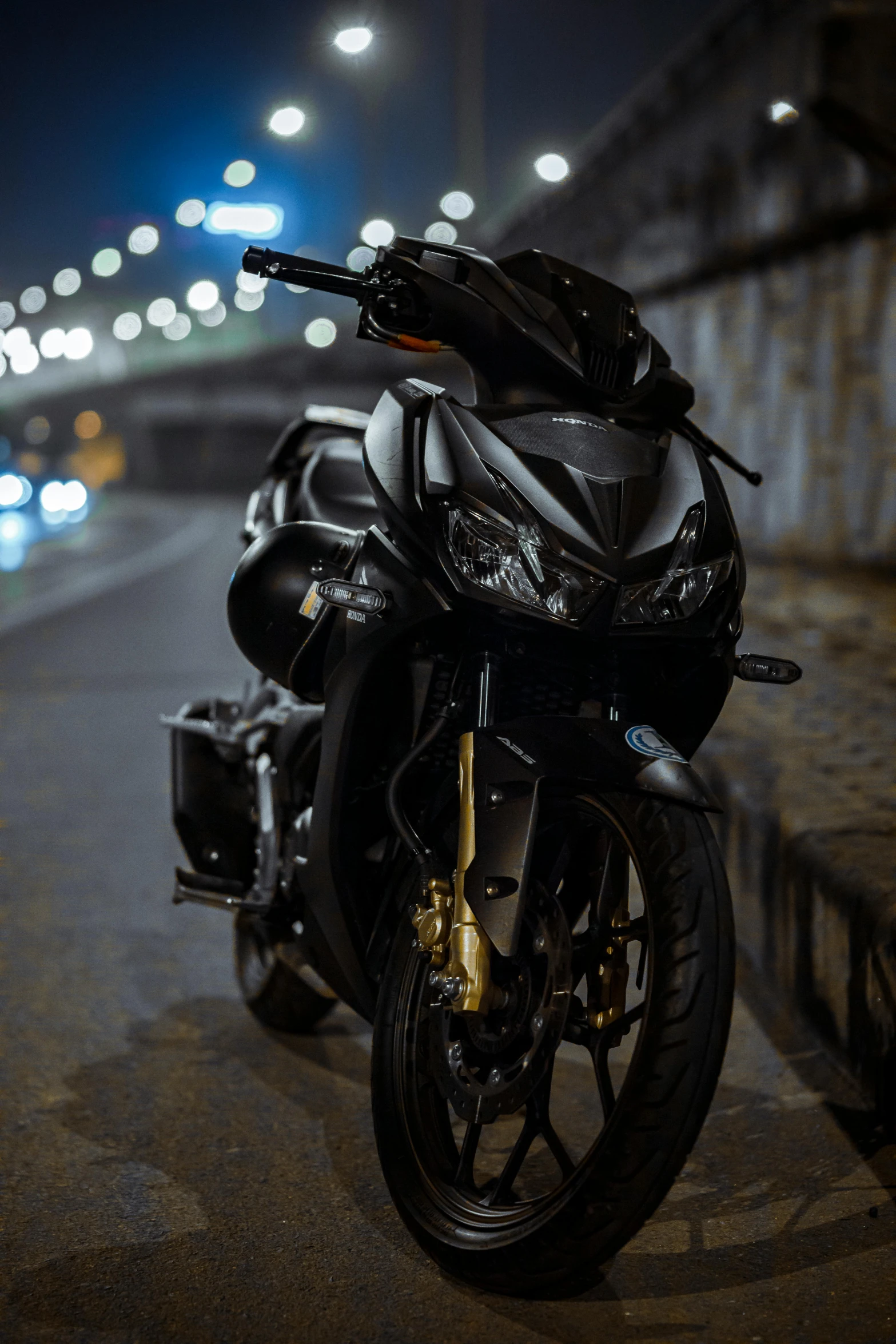 a parked motorcycle with a large bag on it's seat