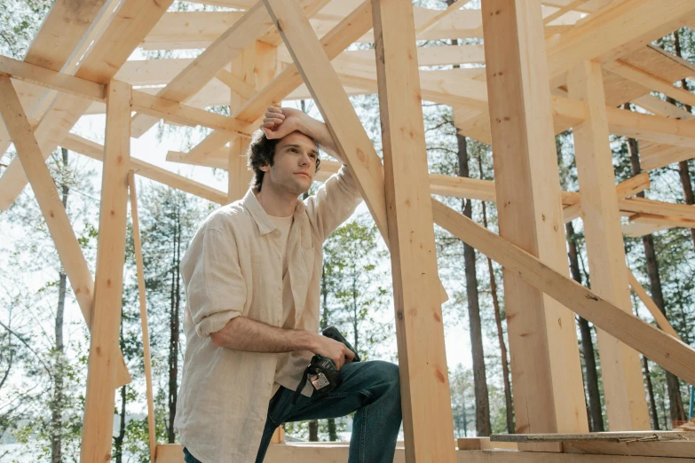 a young man standing on a wooden floor