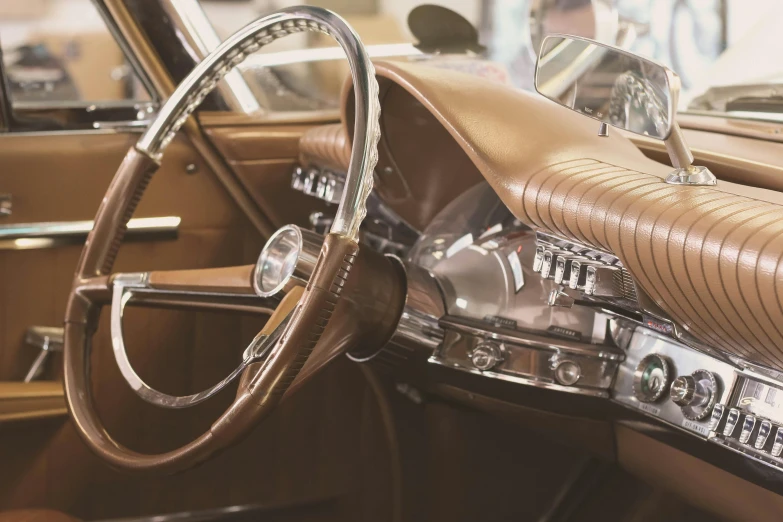 a beige interior and dashboard of an old classic car