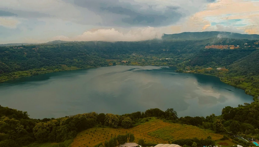 the view looking down at the mountains and the lake