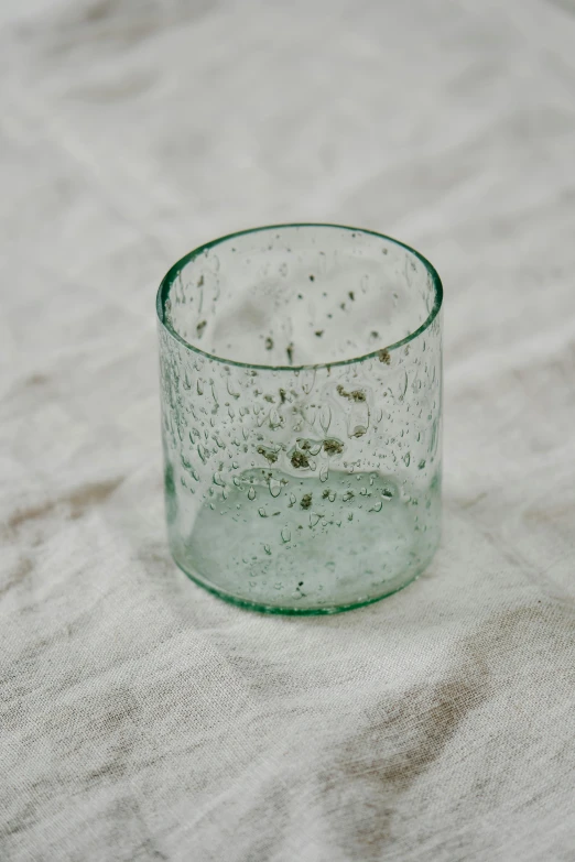 an empty glass sitting on a table