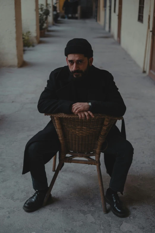 a person sitting on a chair and a cane