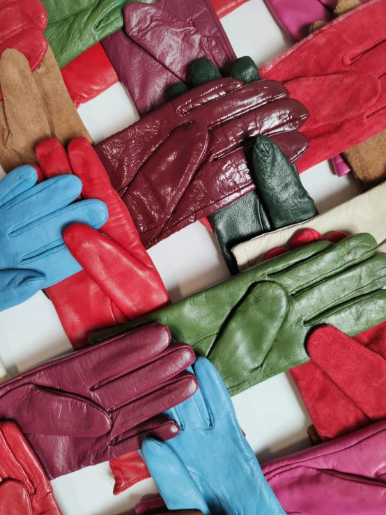 many colors of gloves that are on display