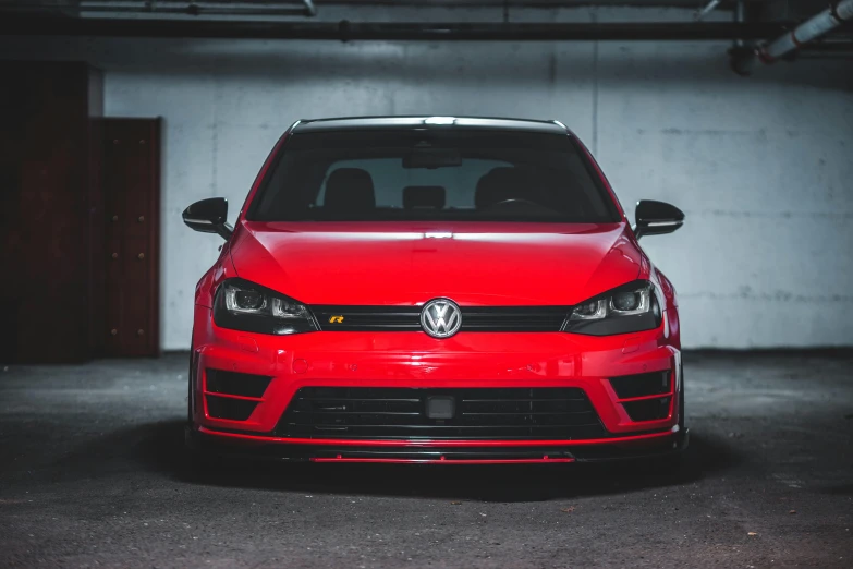 a red car parked in a parking garage