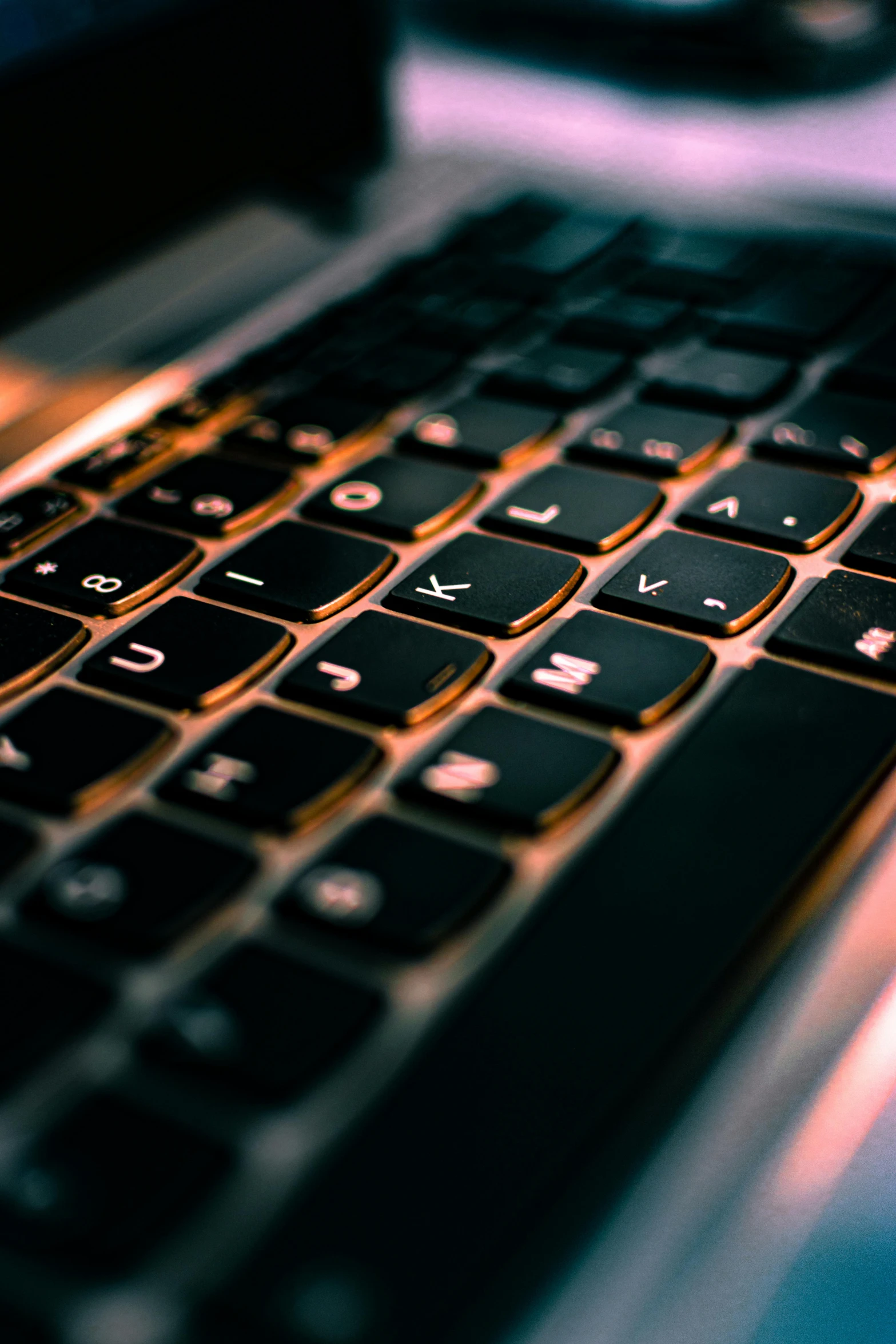 close up of black keys on an open laptop computer