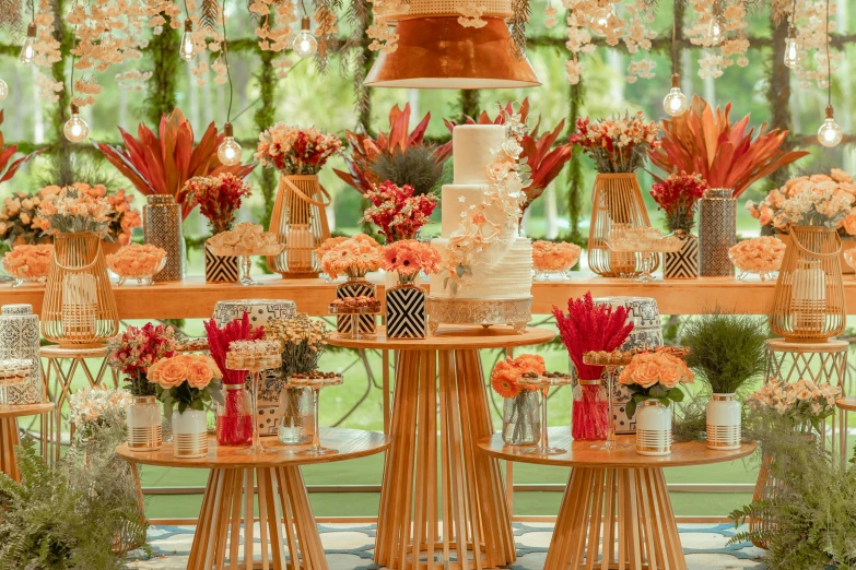 tables with chairs and various flowers in the center