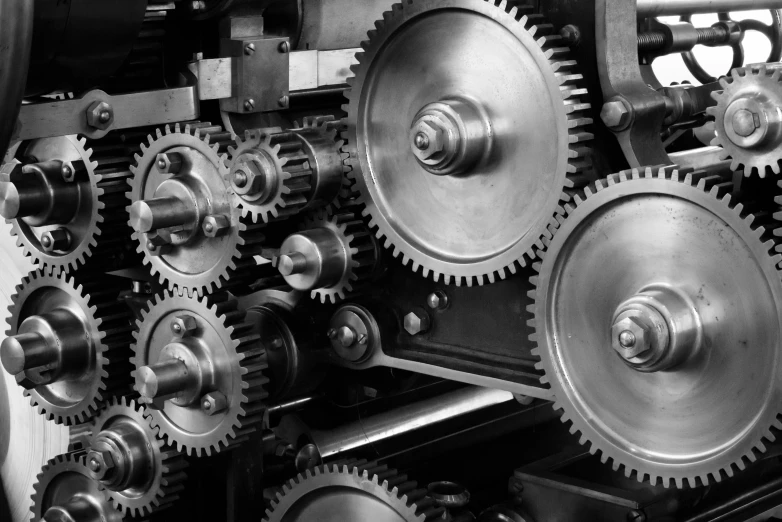 several gears inside a large machine, showing the metal parts