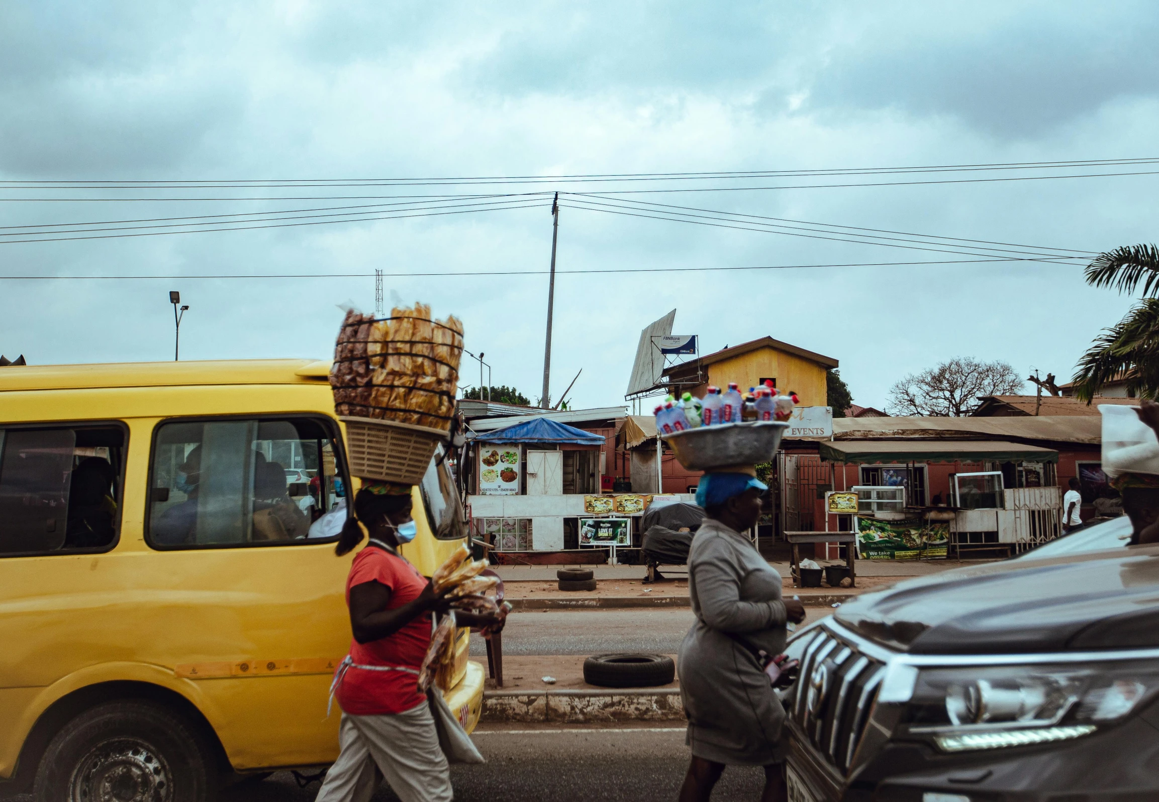 a man is walking behind a truck with cargo on it