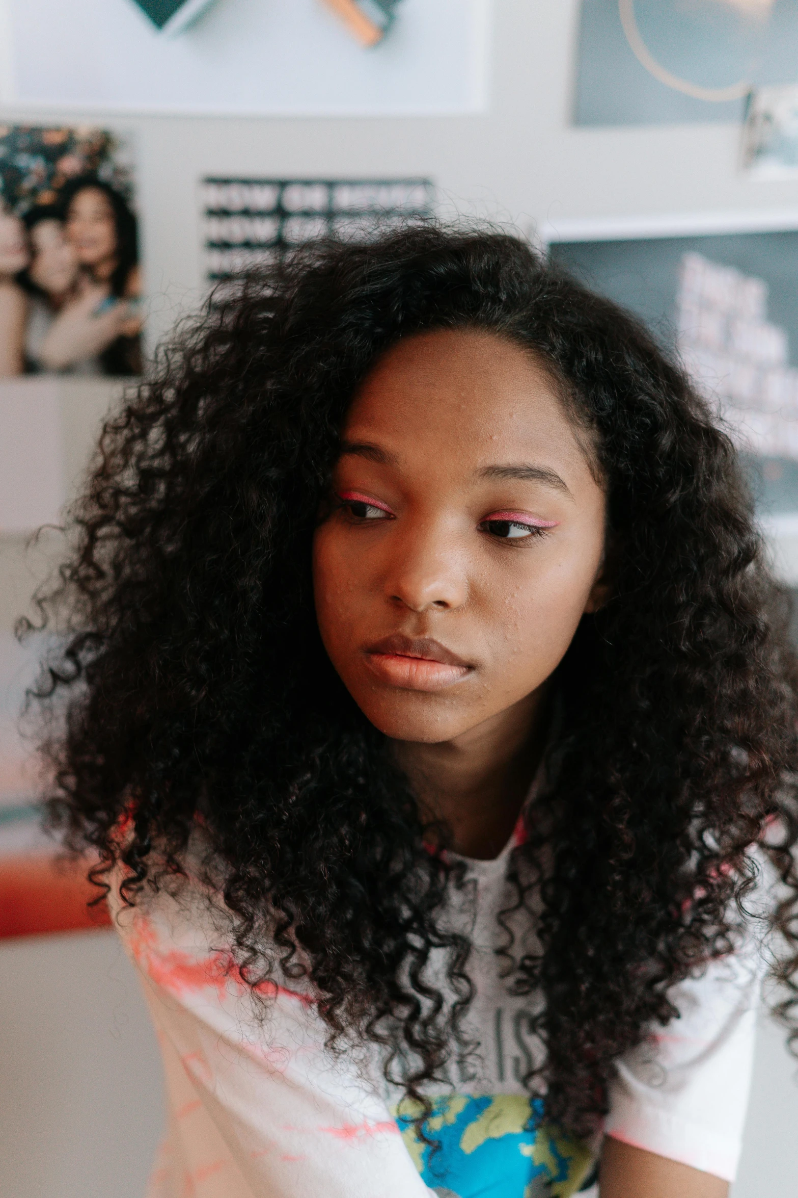 a young woman looking down at the camera