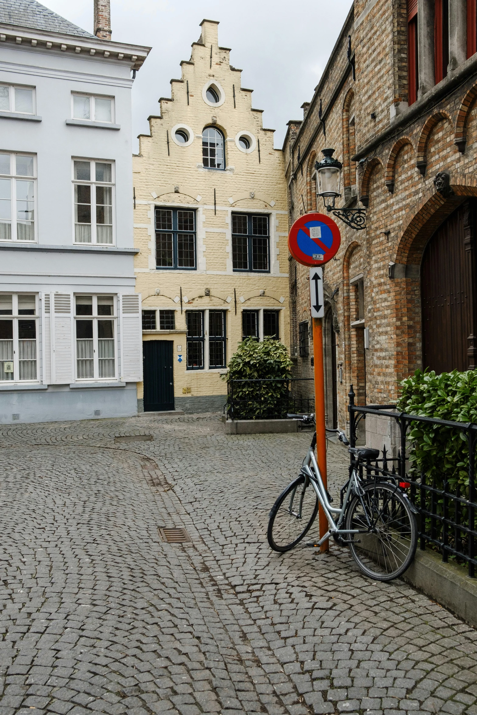 a street with a bike parked next to it in the middle of the road