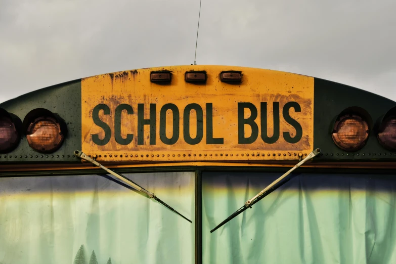 old school bus with the words schoolbus written on it