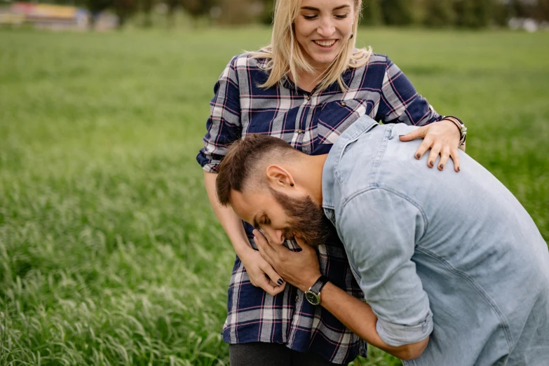 two people emcing while in the middle of a field