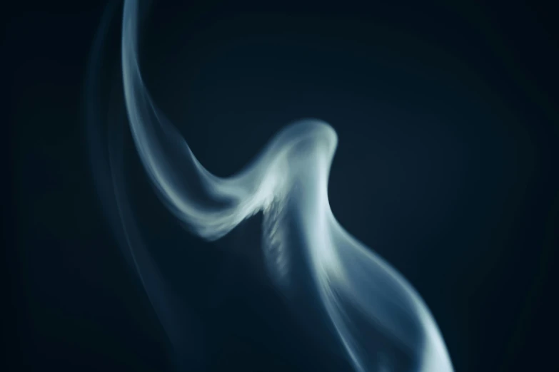 smoke swirling around on a black background