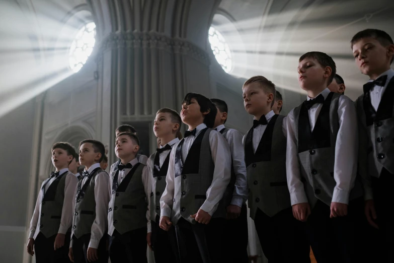 a choir standing in front of an open cathedral