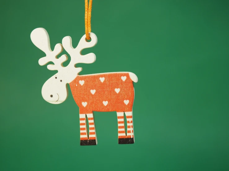 a deer ornament hanging from a string