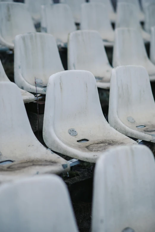 white plastic chairs that are out side