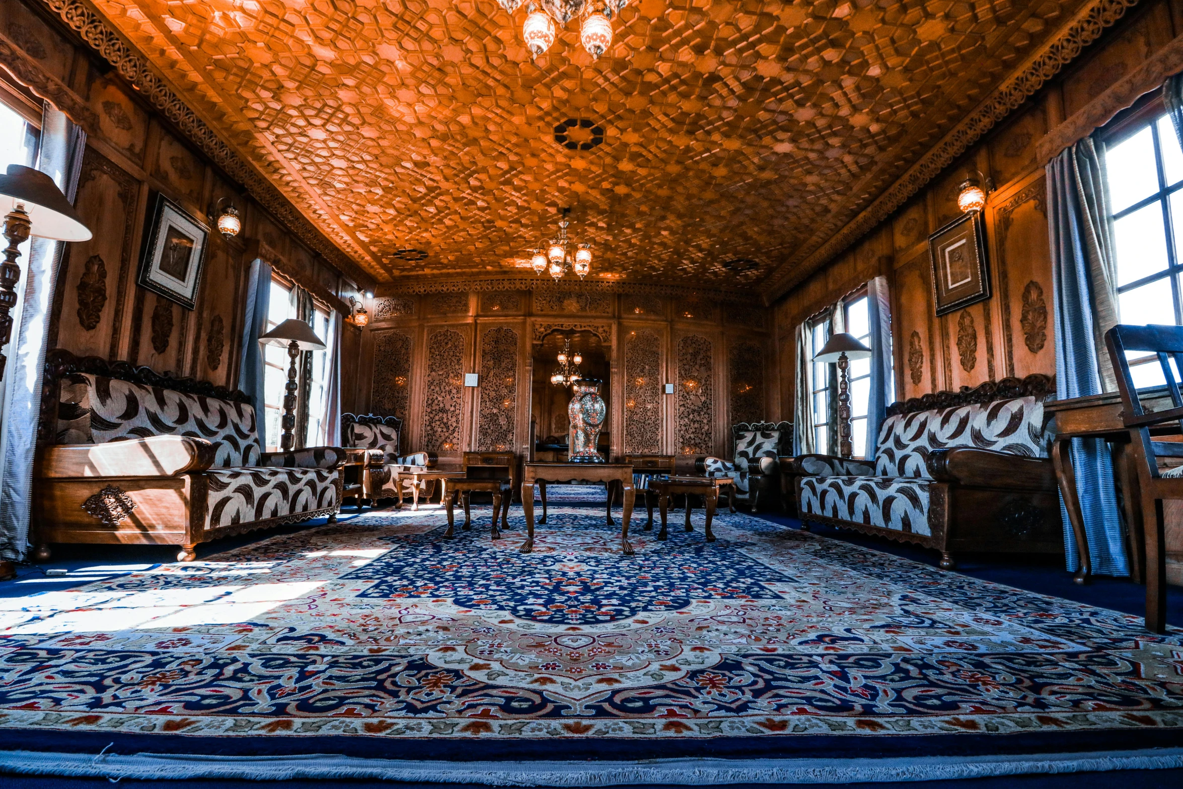 large formal dining room area with ornate wood panelling