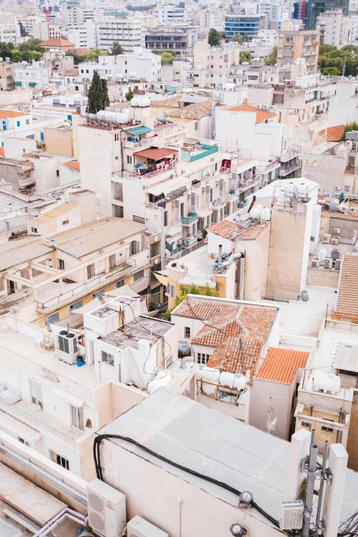 a city filled with tall buildings with many chimneys