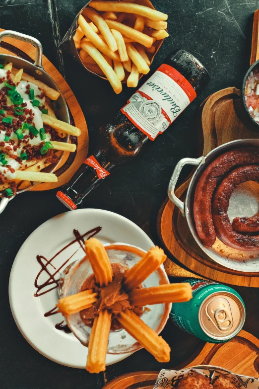 various foods are displayed on wooden trays with sauces and salt