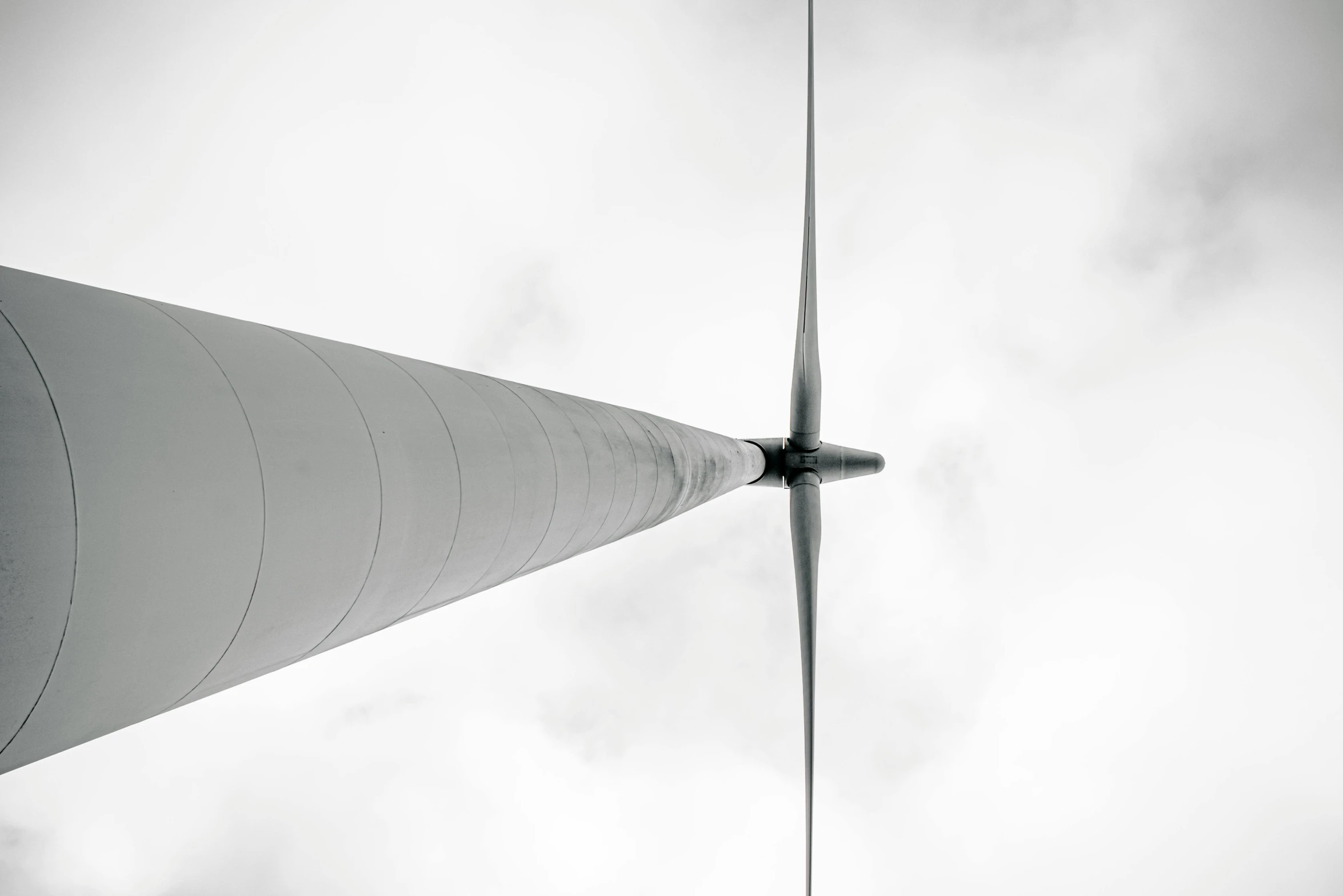 an airplane flying high above some kind of monument