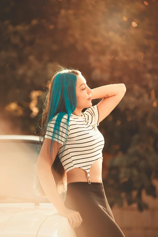 a beautiful young woman with blue hair leaning against a white car