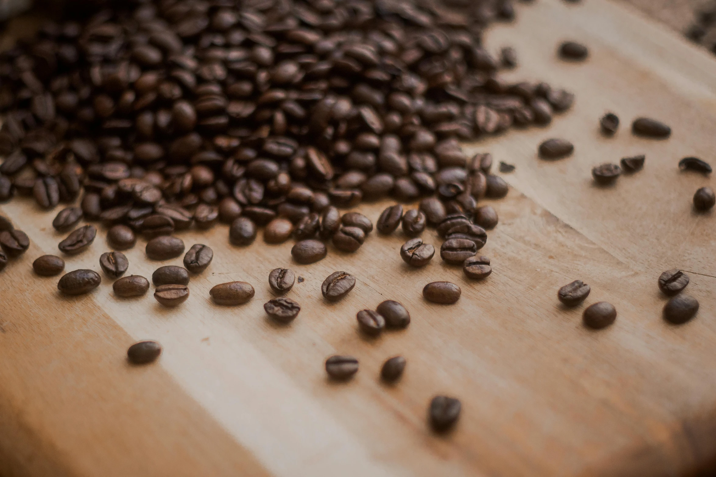 some coffee beans spilled out of a bowl