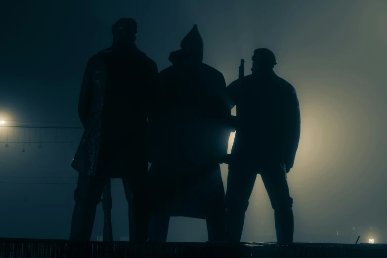 two men stand next to each other on a foggy night