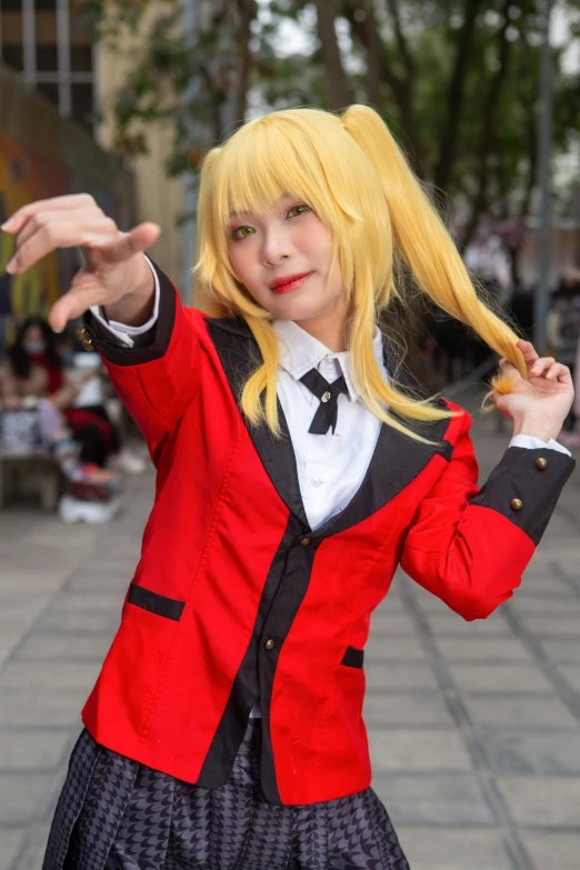 a blond haired girl dressed in a red and black jacket