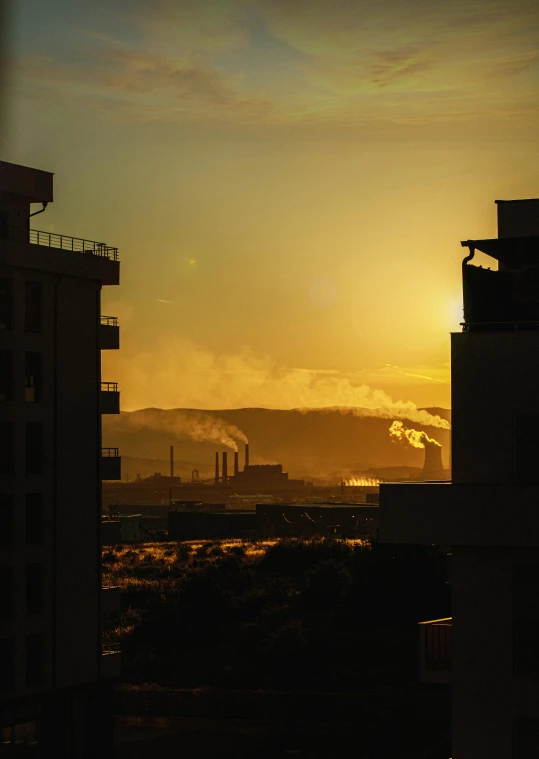 some buildings and sunset in the background